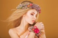 Young model with wreath of bright flowers on her Royalty Free Stock Photo