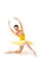 Young modern ballet dancer in yellow dress  on white background Royalty Free Stock Photo