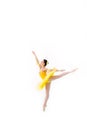 Young modern ballerina with yellow tutu doing the pose on white background Royalty Free Stock Photo