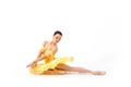 Young modern ballet dancer in yellow dress  on white background Royalty Free Stock Photo