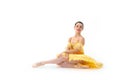 Young modern ballet dancer in yellow dress  on white background Royalty Free Stock Photo