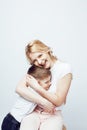 Young modern blond curly mother with cute son together happy smiling family posing cheerful on white background Royalty Free Stock Photo