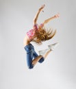 Young modern dancing girl in jeans