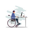 A young modern guy is sitting in a wheelchair and working at a computer. A disabled person works in an office