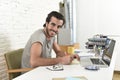 Young modern hipster style student or businessman working with laptop at home office Royalty Free Stock Photo