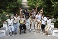 Young modern Indian men pose, enjoy life, jump up