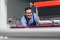 Modern industrial machine operator working in factory. Worker on the machine Royalty Free Stock Photo