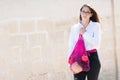 A young modern woman with purchases. Girl carries fruits and vegetables in an eco-friendly string, reusable net bag. Organic