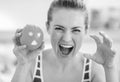 Young woman scaring with orange with hallowing face Royalty Free Stock Photo