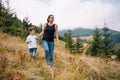 Young mom with baby boy travelling. Mother on hiking adventure with child, family trip in mountains. National Park. Hike with Royalty Free Stock Photo