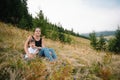 Young mom with baby boy travelling. Mother on hiking adventure with child, family trip in mountains. National Park. Hike with Royalty Free Stock Photo