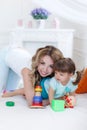 Young mom with her child play together Royalty Free Stock Photo