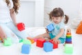 Young mom with her child play together Royalty Free Stock Photo