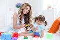 Young mom with her child play together Royalty Free Stock Photo