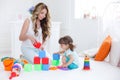 Young mom with her child play together Royalty Free Stock Photo