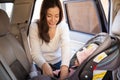 Young mom securing a child car seat Royalty Free Stock Photo