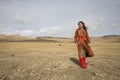 Young mongolian girl in a steppe