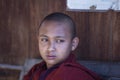Young monk in buddhist monastery near Inle lake, Myanmar, Burma, close up