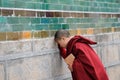 Young monk praying