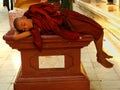 Young monk sleeping at Shwedagon Pagoda, Yangon, Myanmar