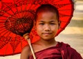 A young monk with umbrella in Bagan, Myanmar