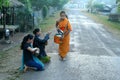 Young Monks collecting alms