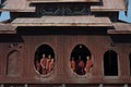 Young monks at window of wooden Church in temple.