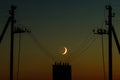 The young Moon with a power line. Royalty Free Stock Photo