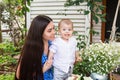 Young mother with baby kid in the garden Royalty Free Stock Photo