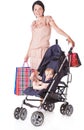 Young mother with baby in perambulator Royalty Free Stock Photo