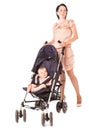 Young mother with baby in perambulator Royalty Free Stock Photo