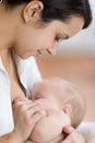 Young mother breast feeding her small newborn baby Royalty Free Stock Photo