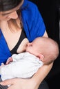 Young mother is breastfeeding her newborn,  mother breast feeding and hugging her baby boy Royalty Free Stock Photo