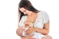 Young mother breastfeeds her baby. Breast-feeding. White background