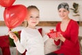 Young mother, cancer patient, and her cute daughter, celebrating return home from hospital. Welcome home or birthday party. Royalty Free Stock Photo