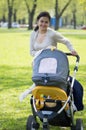 Young mother with a carriage Royalty Free Stock Photo