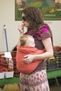 Young mother carries baby around her stomach