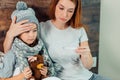 Young mother checking temperature of child Royalty Free Stock Photo