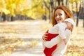 Young mother with child walking in autumn park Royalty Free Stock Photo