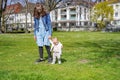 A young mother with a child walks on the grass Royalty Free Stock Photo