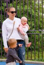 Young mother with children on playground