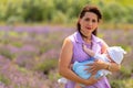 Young mother clutching her baby son to her chest Royalty Free Stock Photo