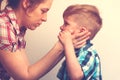 Young mother comforting her little crying child Royalty Free Stock Photo