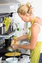 Young Mother Cooking at Home. Royalty Free Stock Photo