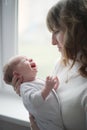 Young mother with crying baby