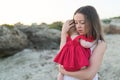 Young mother with cute baby girl outdoors on the beach Royalty Free Stock Photo