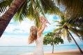 Young mother and cute baby playing on tropical beach Royalty Free Stock Photo