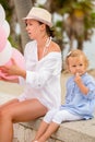 Young mother and daughter at a birthday party Royalty Free Stock Photo