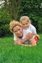 Young mother and daughter laying on the grass Royalty Free Stock Photo