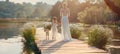 Young mother and daughter walking in sunny park with charming pet dog on a leisurely stroll